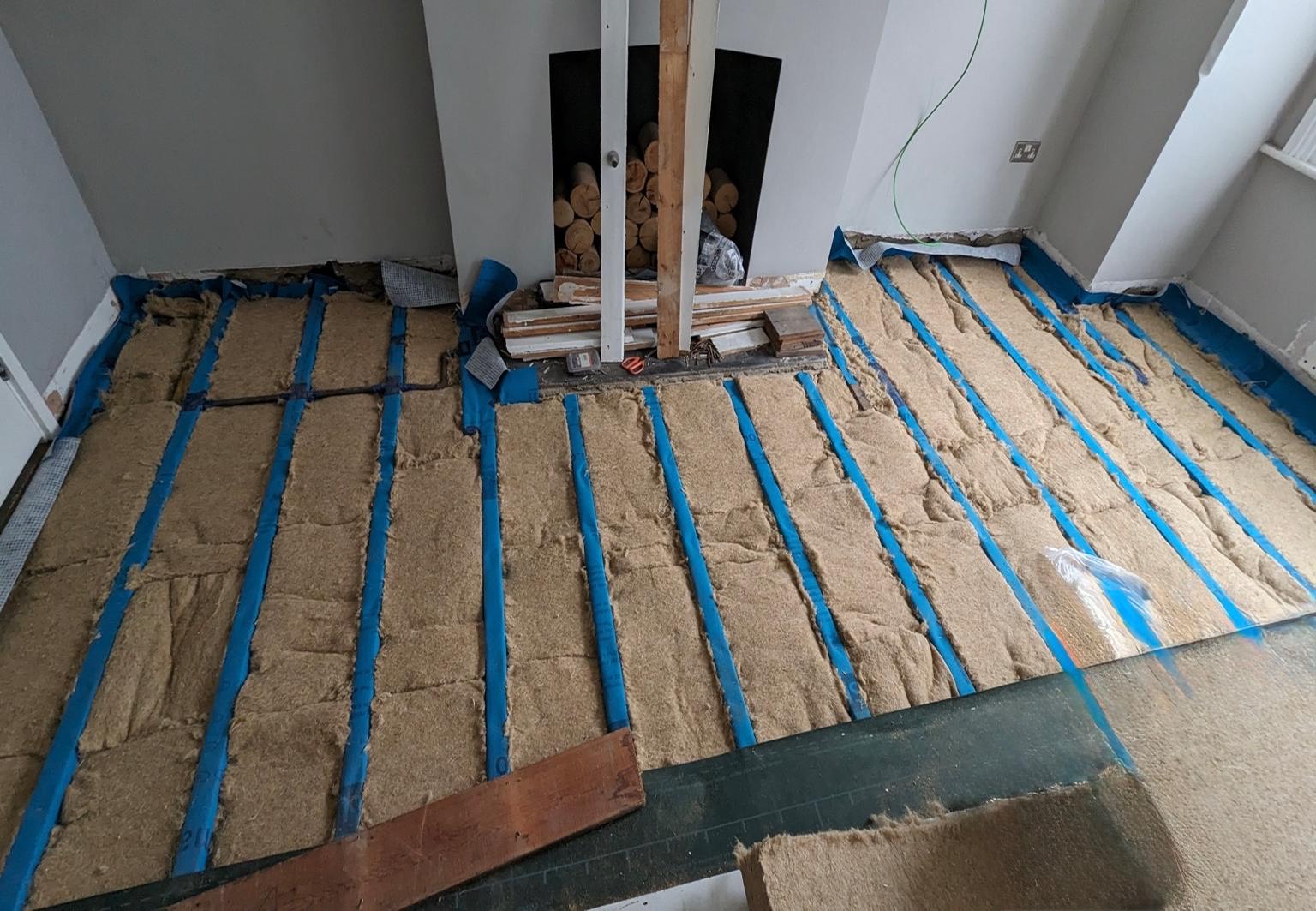 Underfloor insulation being installed